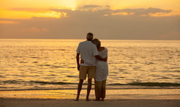 couple on the beach needing hormone replacement therapy  