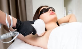 A woman getting laser hair removal.   