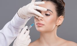 Woman getting a non-surgical nose job  